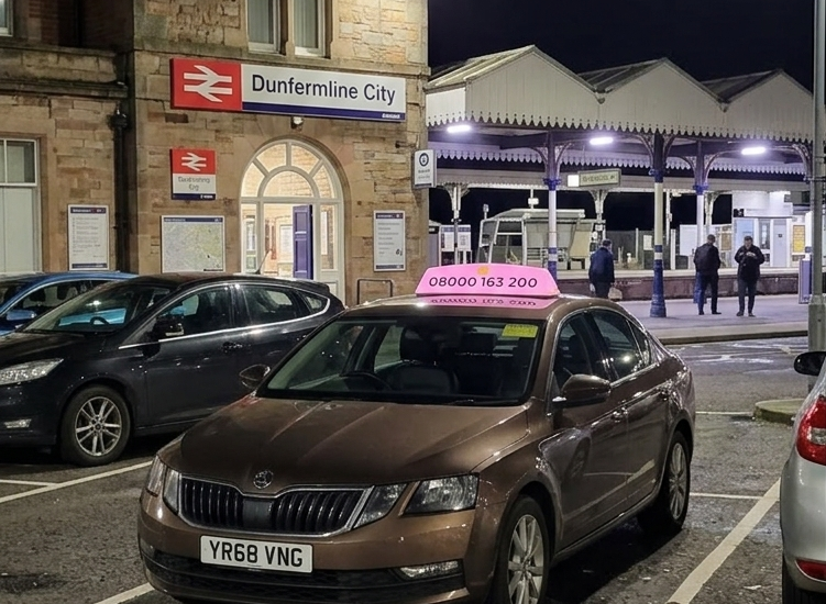 Dunfermline City Station Taxi waiting for passenger pickup