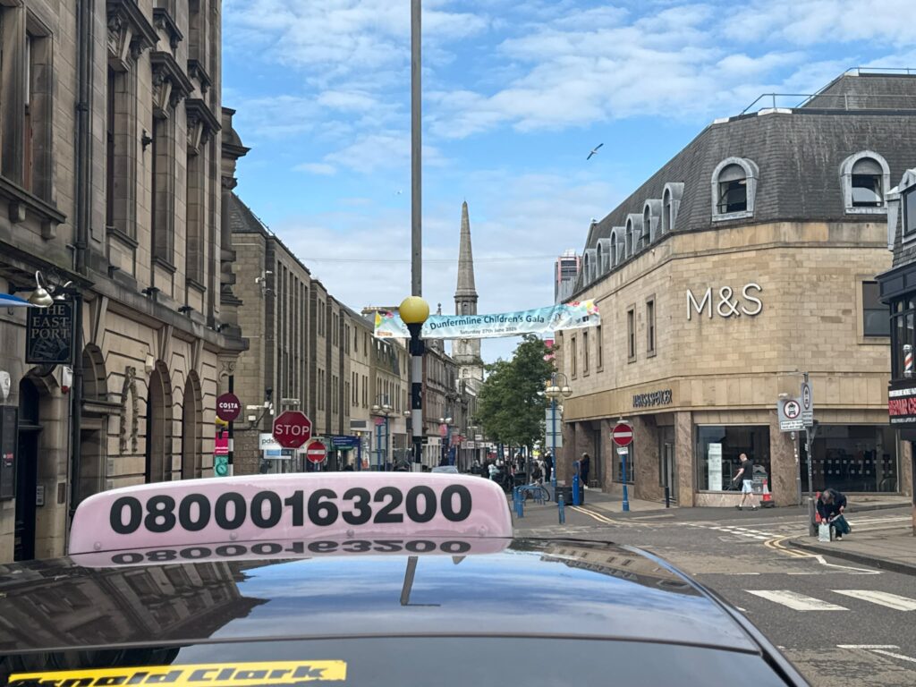 Das Taxis vehicle outside Kingsgate Shopping Centre in Dunfermline